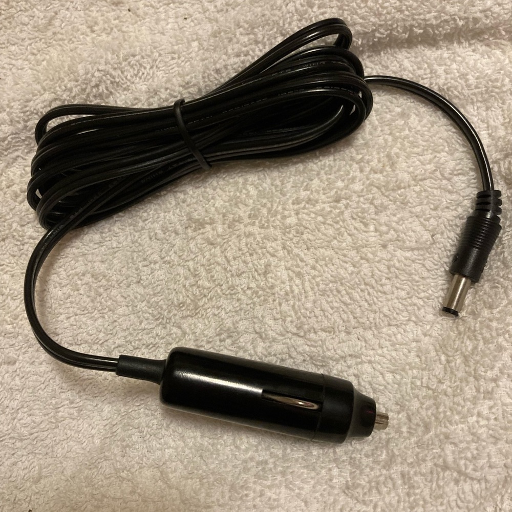 Car charger The kind of plug is in the pitchers Never used New